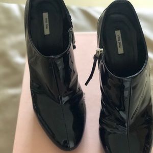 Black patent leather ankle boots